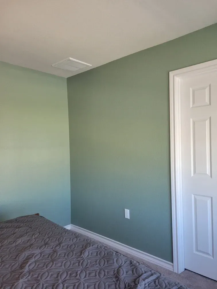 Bedroom painted green in east austin