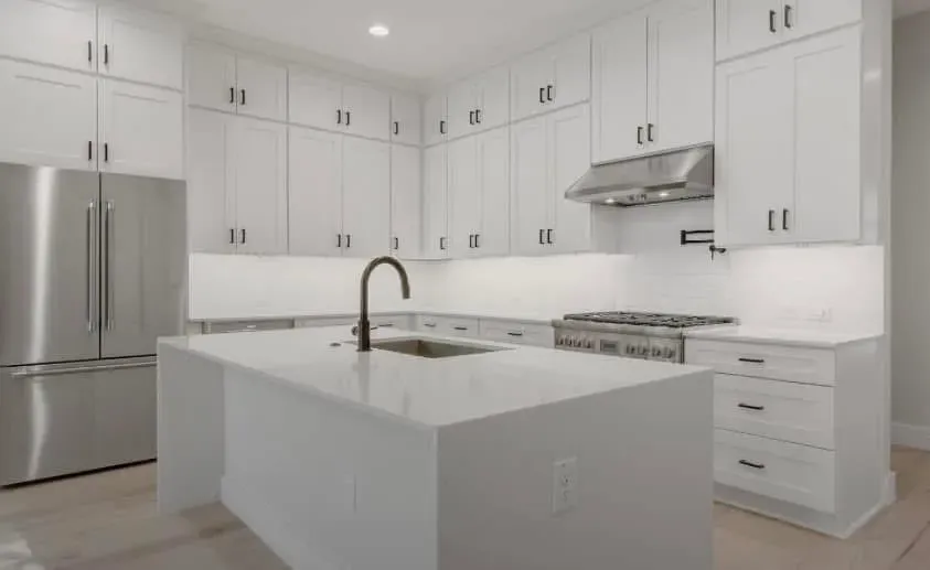 White quartz countertops in a white Austin kitchen