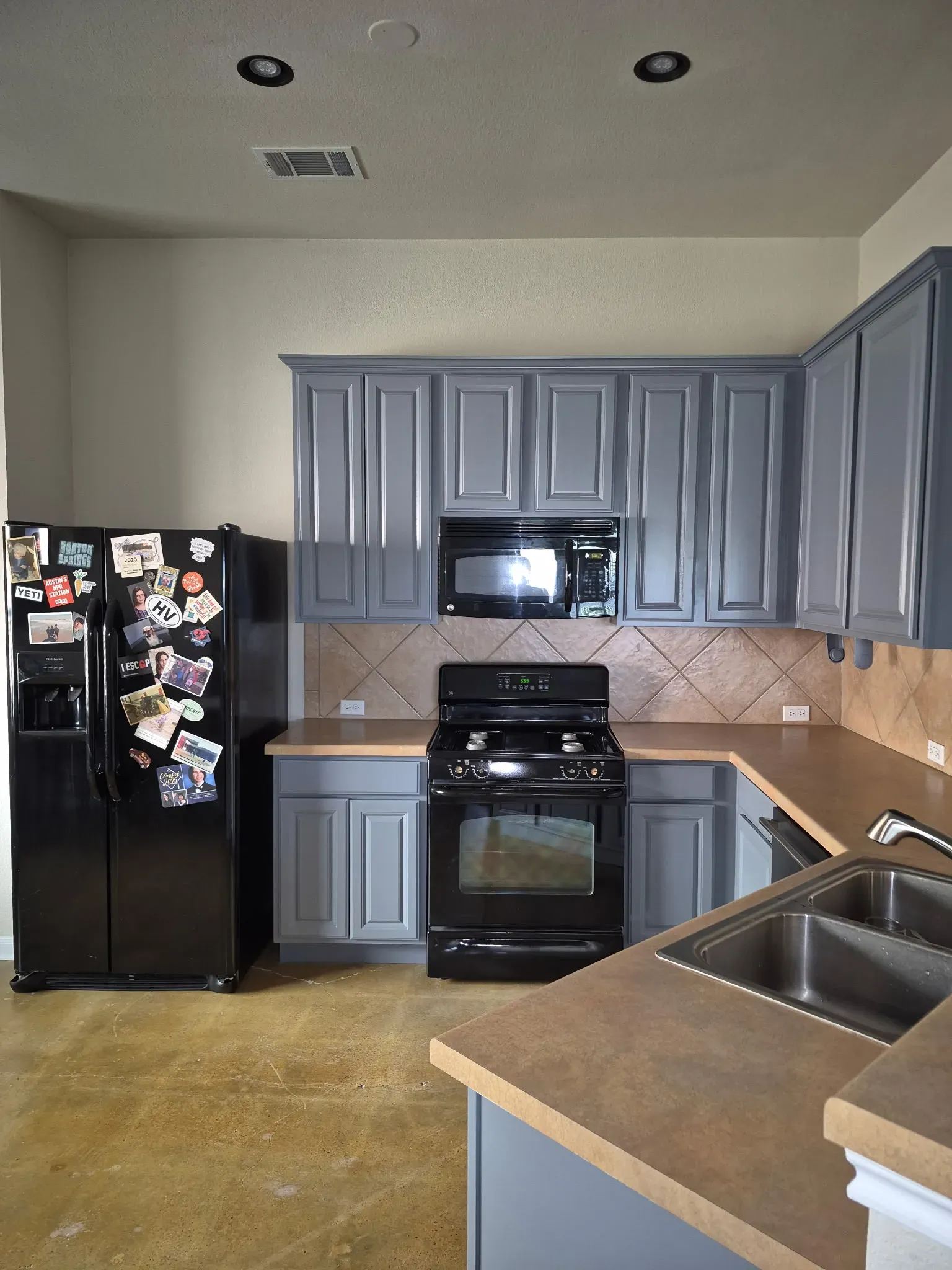 Wood kitchen cabinets primed and repainted
